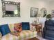Stylish living room with a decorative mirror and striped sofa at 734 Maryland Ave, Winter Park, FL 32789