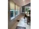 Bright sunroom with whitewashed walls and hardwood floors at 734 Maryland Ave, Winter Park, FL 32789