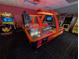 Air hockey and other arcade games offer a fun and engaging recreational space for residents in the entertainment center at 8125 Resort Village Dr # 5902, Orlando, FL 32821