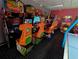 Arcade games fill the entertainment center, providing a nostalgic and fun recreational space for residents and guests at 8125 Resort Village Dr # 5902, Orlando, FL 32821