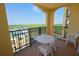 Spacious balcony with outdoor seating, offering views of lush greenery and the surrounding landscape at 8125 Resort Village Dr # 5902, Orlando, FL 32821