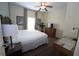 Serene bedroom featuring a queen bed, soft natural light, and a ceiling fan, offering a relaxing space at 8125 Resort Village Dr # 5902, Orlando, FL 32821