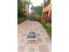 Outdoor community cornhole setup with tiled flooring and landscaping offers a relaxing and fun recreational space for residents at 8125 Resort Village Dr # 5902, Orlando, FL 32821
