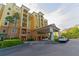 Attractive building with a covered entrance, landscaping, and convenient parking at 8125 Resort Village Dr # 5902, Orlando, FL 32821