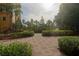 Well-maintained community grounds with mature trees, lush landscaping, and a paved walkway at 8125 Resort Village Dr # 5902, Orlando, FL 32821