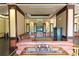 Well-appointed lobby with comfortable seating, decorative shelves and a fireplace at 8125 Resort Village Dr # 5902, Orlando, FL 32821