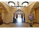 Elegant lobby with decorative lighting, archways, and information signs at 8125 Resort Village Dr # 5902, Orlando, FL 32821