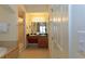 Bathroom with double sink vanity, walk-in shower, and separate jacuzzi tub at 8125 Resort Village Dr # 5902, Orlando, FL 32821