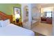 Well-lit bedroom with a whirlpool tub in the main bathroom, and tiled floor at 8125 Resort Village Dr # 5902, Orlando, FL 32821