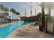 Resort-style pool area featuring a unique pirate ship structure and palm trees at 8125 Resort Village Dr # 5902, Orlando, FL 32821