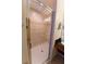 Modern bathroom shower featuring glass doors and tiled walls, offering a clean and stylish design at 8125 Resort Village Dr # 5902, Orlando, FL 32821