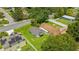 An aerial view shows the charming homes nestled among lush trees in this vibrant neighborhood at 515 9Th St, Winter Garden, FL 34787