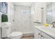 Modern bathroom featuring a walk-in shower and bright white vanity at 515 9Th St, Winter Garden, FL 34787