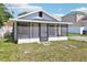Charming home featuring a screened porch and secure gate entrance at 515 9Th St, Winter Garden, FL 34787