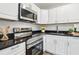 Modern kitchen with stainless steel appliances and granite countertops at 515 9Th St, Winter Garden, FL 34787