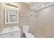 Updated bathroom features a vanity, toilet, and a tiled walk-in shower with neutral toned tile at 562 Nardello Dr, Deltona, FL 32725