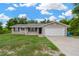 Charming single-story home with a two-car garage, brick accents and an inviting entrance at 562 Nardello Dr, Deltona, FL 32725