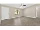 Bright living room featuring a large window, ceiling fan, and hard surface floors at 562 Nardello Dr, Deltona, FL 32725