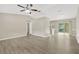 Open-concept living area featuring modern flooring and access to the outdoors at 562 Nardello Dr, Deltona, FL 32725