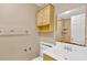 Well-lit bathroom featuring tile floors, single vanity, and shower at 6906 Cocos Dr, Orlando, FL 32807