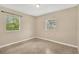 Simple bedroom with natural light from windows and neutral wall color at 6906 Cocos Dr, Orlando, FL 32807