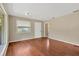 Spacious living room with hardwood floors, lots of natural light, and a neutral color scheme at 6906 Cocos Dr, Orlando, FL 32807