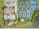 An aerial view of a well-maintained community showcasing a pool, tennis courts, and bocce ball court at 414 Long Cove Ct, Ormond Beach, FL 32174