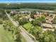 Beautiful aerial view of homes in community near golf course and lake at 414 Long Cove Ct, Ormond Beach, FL 32174