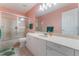 Bathroom featuring shower, vanity, and large mirror at 414 Long Cove Ct, Ormond Beach, FL 32174