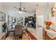 Bright dining area with seating for four, a ceiling fan, and an adjacent office nook at 414 Long Cove Ct, Ormond Beach, FL 32174
