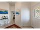 Welcoming entryway with neutral tones, decorative mirror, and stylish accents leading into the home at 414 Long Cove Ct, Ormond Beach, FL 32174