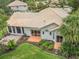 Home exterior featuring patio and manicured landscaping at 414 Long Cove Ct, Ormond Beach, FL 32174