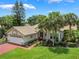 Beautiful home with inviting entrance framed by landscaping and brick driveway at 414 Long Cove Ct, Ormond Beach, FL 32174