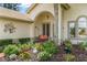 Welcoming front porch with colorful flowers and tasteful decor at 414 Long Cove Ct, Ormond Beach, FL 32174