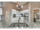 Modern kitchen with white cabinets, stainless steel appliances, and granite countertops at 414 Long Cove Ct, Ormond Beach, FL 32174