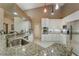 Stylish kitchen featuring white cabinets, stainless steel appliances, and granite countertops at 414 Long Cove Ct, Ormond Beach, FL 32174