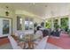 Covered patio with seating, a dining area, and great views of the backyard landscaping at 414 Long Cove Ct, Ormond Beach, FL 32174