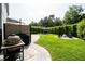 Backyard with gazebo, outdoor kitchen, barbecue, firepit and patio, perfect for outdoor gatherings and relaxation at 5095 Southlawn Ave, Orlando, FL 32811