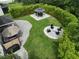 Aerial view showcasing a well-kept backyard with an outdoor kitchen, gazebo, fire pit, patio, and privacy bamboo at 5095 Southlawn Ave, Orlando, FL 32811