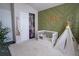 Cozy bedroom features a custom accent wall and a comfortable rug at 5095 Southlawn Ave, Orlando, FL 32811