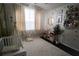 bedroom with a window, heart wallpaper, comfortable rug, and stuffed animal decorations at 5095 Southlawn Ave, Orlando, FL 32811