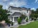 Charming home featuring a covered porch and manicured landscaping at 5095 Southlawn Ave, Orlando, FL 32811