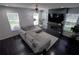 Cozy living room featuring a sectional sofa, a ceiling fan and a modern fireplace at 5095 Southlawn Ave, Orlando, FL 32811