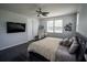 Main bedroom with dark wood floors, and abundant natural light from the surrounding windows at 5095 Southlawn Ave, Orlando, FL 32811