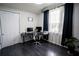 Home office features a large desk and a window with natural light at 5095 Southlawn Ave, Orlando, FL 32811