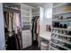 Walk-in closet with lots of storage, vanity with window, shelves, and closet rod, excellent for organization at 5095 Southlawn Ave, Orlando, FL 32811