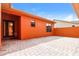 Beautiful home exterior featuring a brick-paved patio and an inviting entrance with a glass-accented front door at 154 Indian Wells Ave, Kissimmee, FL 34759