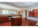 Well-appointed kitchen with granite countertops, hardwood floors, and stainless-steel appliances at 154 Indian Wells Ave, Kissimmee, FL 34759