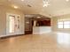 Open floor plan with tile flooring, and lots of light through the double doors and windows at 154 Indian Wells Ave, Kissimmee, FL 34759