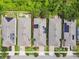 Aerial view of the neighborhood showcasing homes with solar panels and lush landscaping at 1553 Amber Leaf Cir, Ocoee, FL 34761
